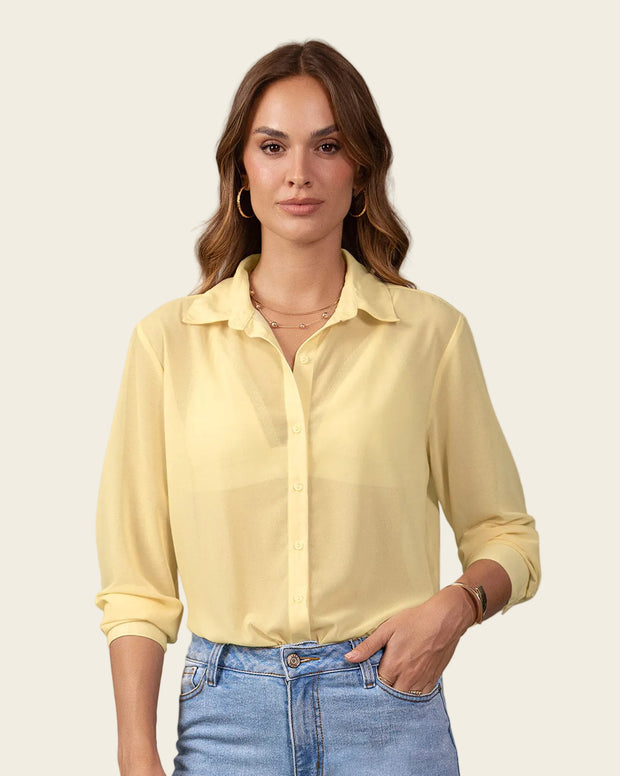 Blusa manga larga elaborada en tela con transparencia