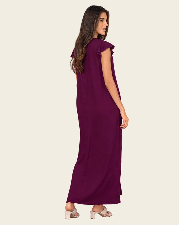 Vestido largo con taches y ojaletes metálicos