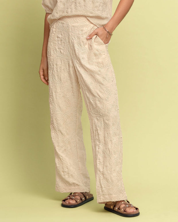 Pantalón bota recta en tela bordada