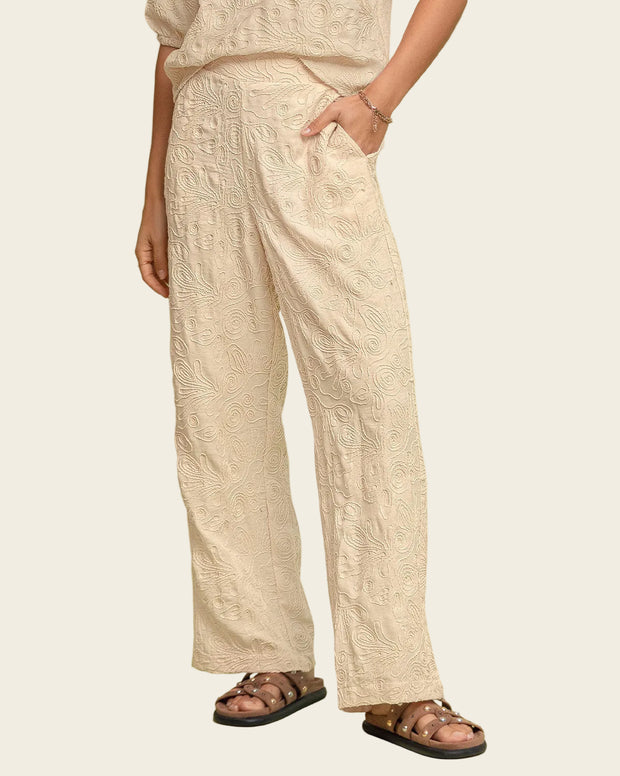 Pantalón bota recta en tela bordada