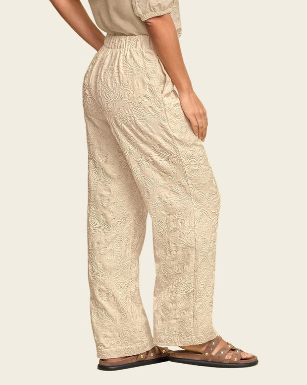 Pantalón bota recta en tela bordada