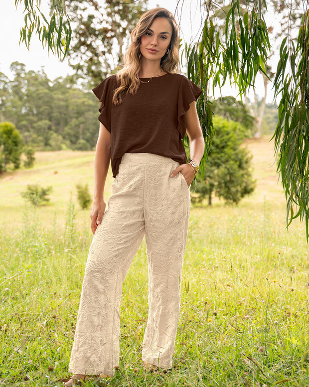 Pantalón bota recta en tela bordada