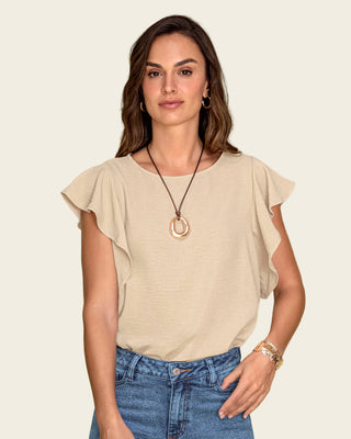 Blusa con boleros en mangas en tela craquelada#color_c76-arena-claro