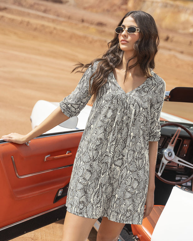 Vestido corto manga larga cuello en V