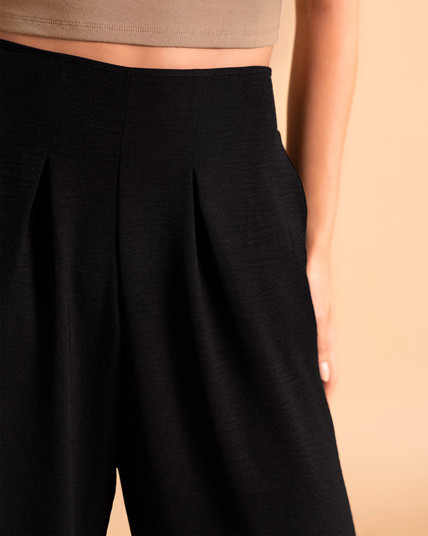 Pantalón bota ancha elaborado en tela con textura
