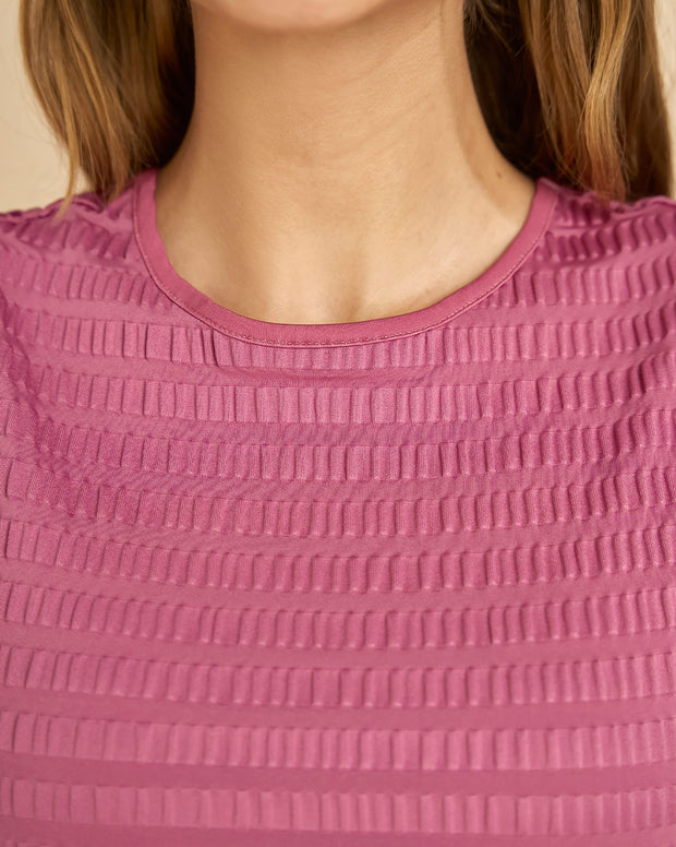 Camiseta manga sisa con cuello alto elaborada en tela con textura