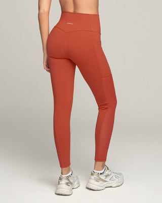 Legging deportivo con bolsillo lateral y detalles en tul#color_336-rojo-canela
