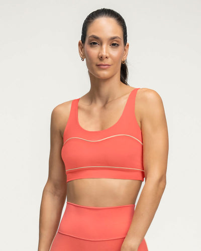 Top deportivo con cargaderas dobles en espalda#color_369-coral