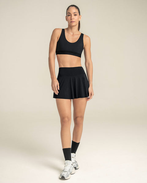 Top deportivo espalda atlética con detalles en tul#color_700-negro