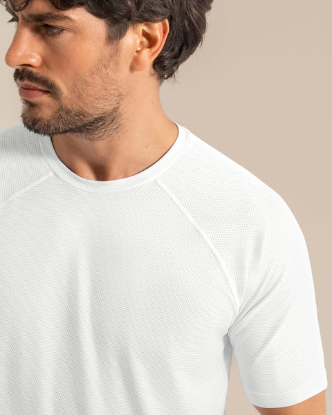 Camiseta deportiva con tela texturizada y transpirable#color_000-blanco