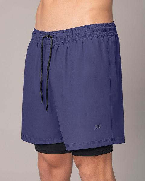 Pantaloneta deportiva con bolsillo lateral con bóxer interno#color_522-azul