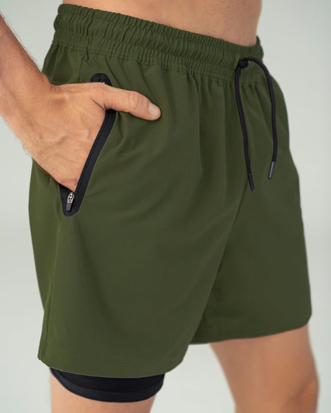 Pantaloneta deportiva con bolsillo lateral con bóxer interno#color_604-verde