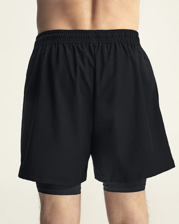 Pantaloneta deportiva con bolsillo lateral con bóxer interno#color_700-negro