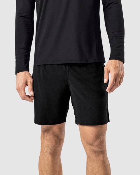 Pantaloneta deportiva con bolsillo trasero y con bóxer interno#color_700-negro