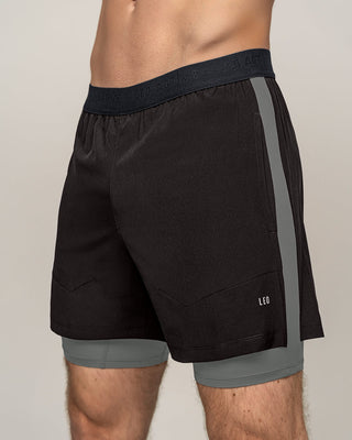 Pantaloneta deportiva con bóxer interno fijo#color_700-negro