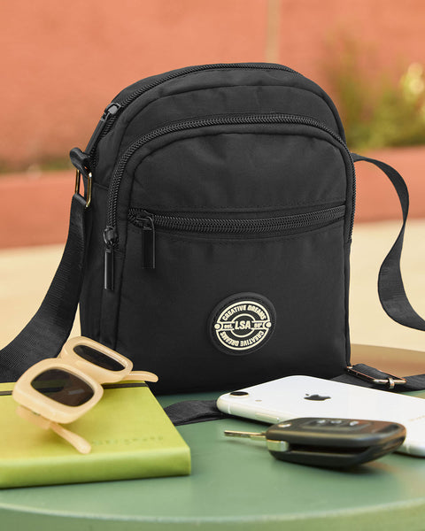 Bolso manos libres con bolsillos externos e interno#color_700-negro