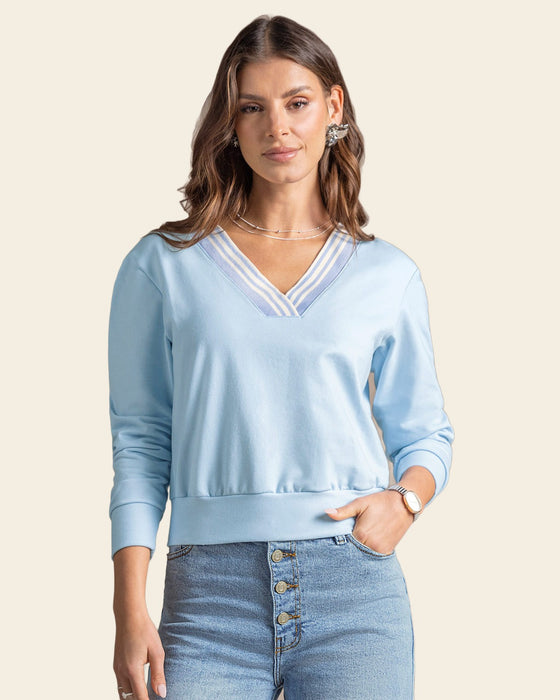 Buzo cuello en V tejido#color_c67-azul-claro