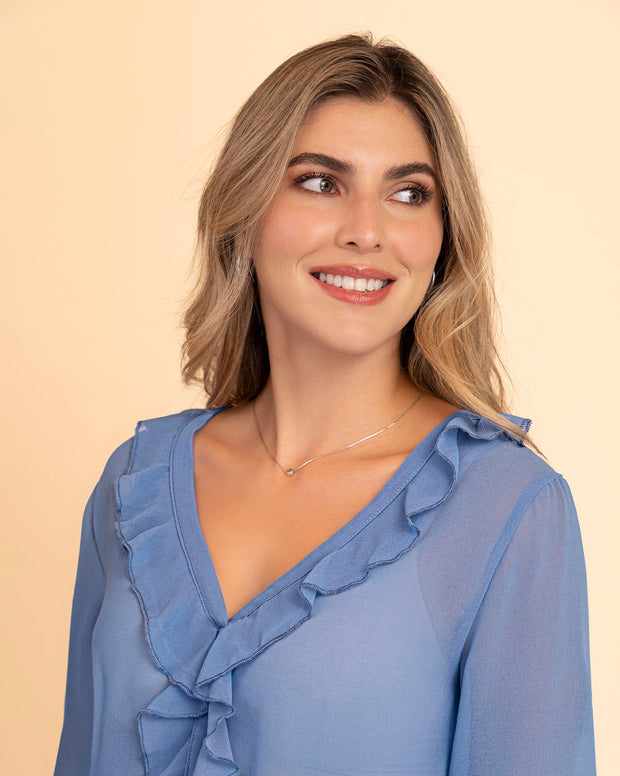 Blusa manga larga con transferencia y boleros