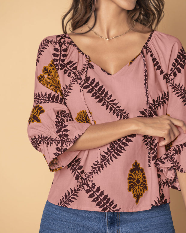 Blusa estampada manga 3/4 con elástico y bolero en puños