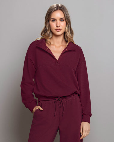 Buzo tipo polo de silueta amplia#color_c37-borgona