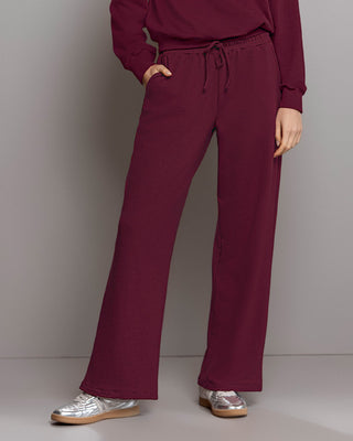 Pantalón bota amplia con elástico y tira anudable en cintura#color_c37-borgona