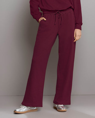 Pantalón bota amplia con elástico y tira anudable en cintura#color_c37-borgona