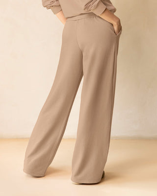 Pantalón bota amplia con elástico y tira anudable en cintura#color_c54-arena