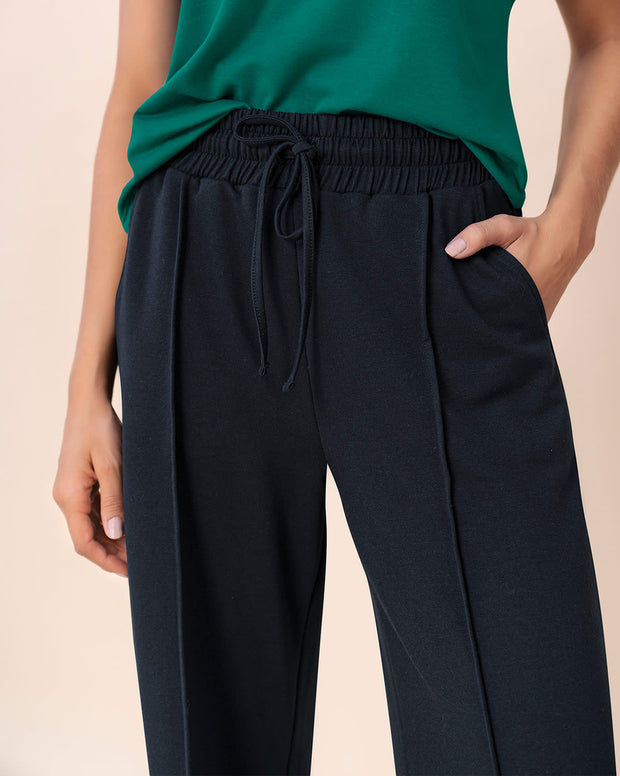 Pantalón tipo jogger con bota ancha