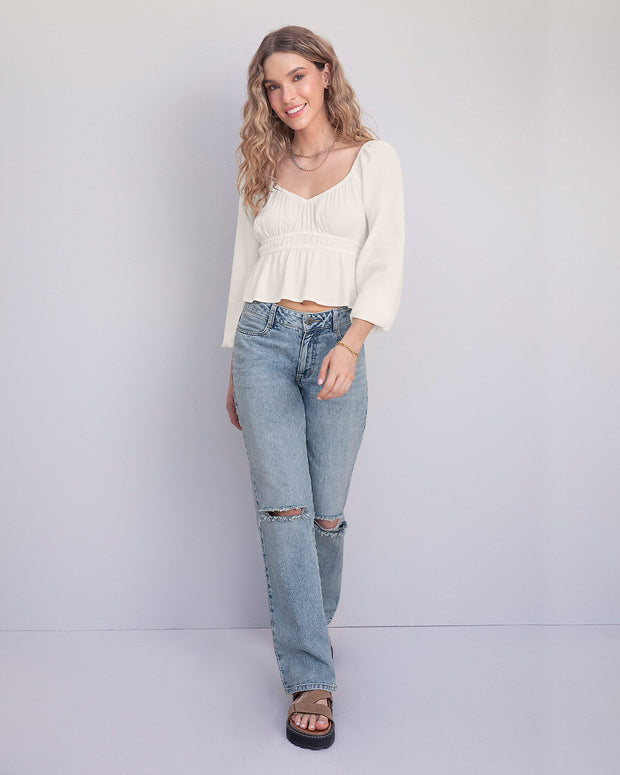Blusa manga larga con elástico en escote