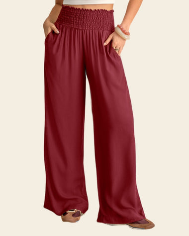 Pantalón bota ancha con nido de abeja en cintura#color_c55-vino