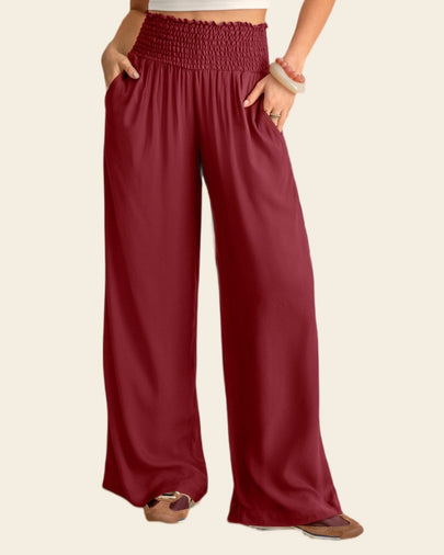 Pantalón bota ancha con nido de abeja en cintura#color_c55-vino