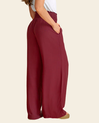 Pantalón bota ancha con nido de abeja en cintura#color_c55-vino