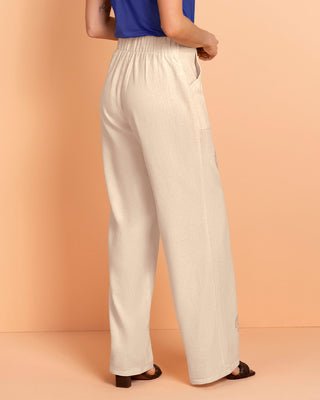 Pantalón bota ancha en tela tipo lino con estampado localizado#color_084-arena