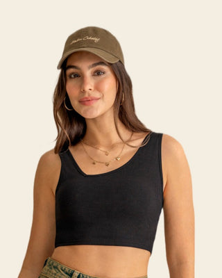 Crop top acanalado con escote asimétrico#color_700-negro