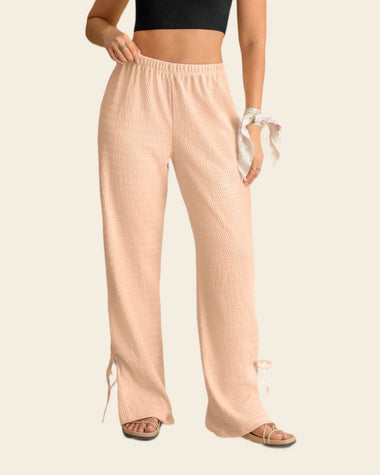 Pantalón amplio con textura y lazos en bota#color_304-rosado