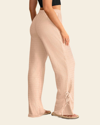 Pantalón amplio con textura y lazos en bota#color_304-rosado