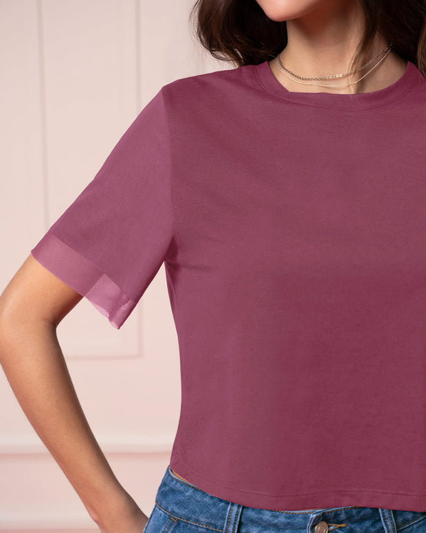 Camiseta cuello redondo con mangas en transparencia